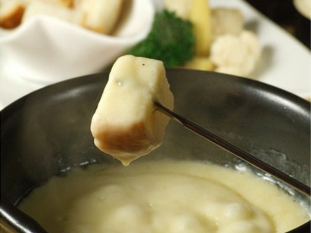 Enjoy original cheese fondue at a restaurant / bar that is open until 5:00 AM