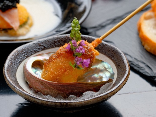 Creative deep-fried skewers featuring sumptuous ingredients in a stylish setting
