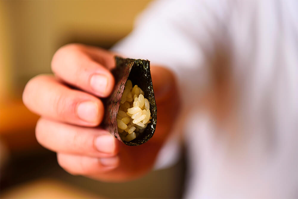 After the appetizers is a vinegared rice rolled in dried seaweed